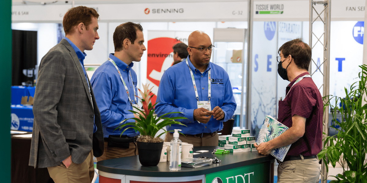 Visitors talking to exhibitors